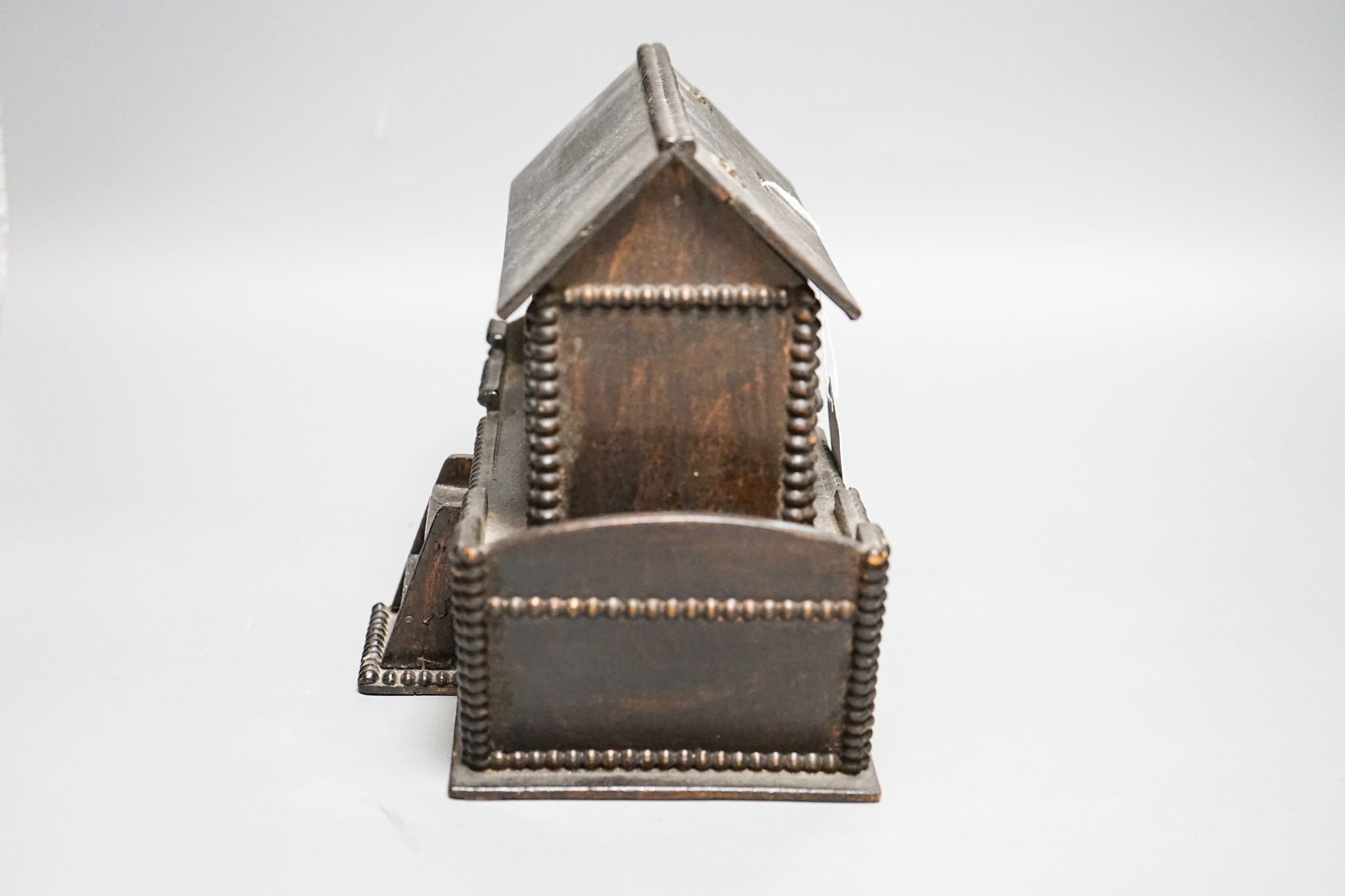 A late 19th century/early 20th century stained plywood Noah’s Ark money box 25cm